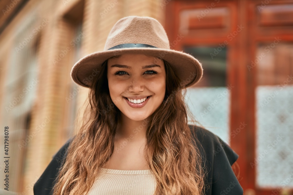 Young hispanic tourist woman smiling happy standing at the city. Young hispanic tourist woman smiling happy standing at the city.