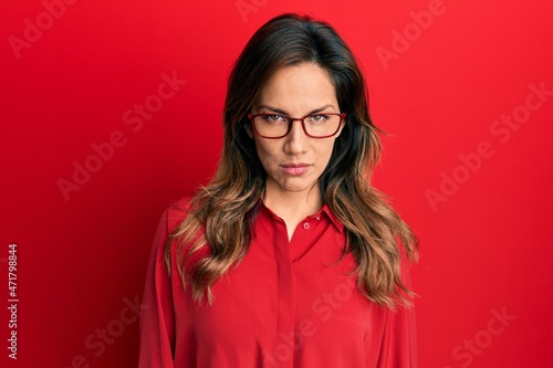 Young latin woman wearing casual clothes and glasses skeptic and nervous, frowning upset because of problem. negative person. © Krakenimages.com