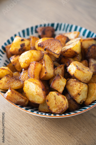 Roasted potatoes served in bowl