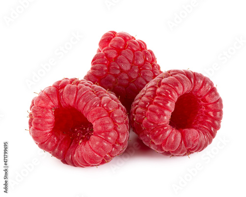 Three ripe raspberries isolated on white background.
