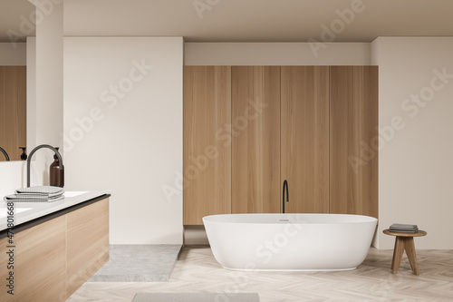 Light bathroom interior with sink and mirror  tub and table
