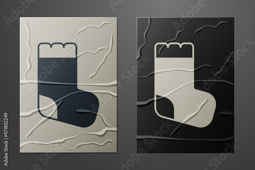 White Baby socks clothes icon isolated on crumpled paper background. Paper art style. Vector