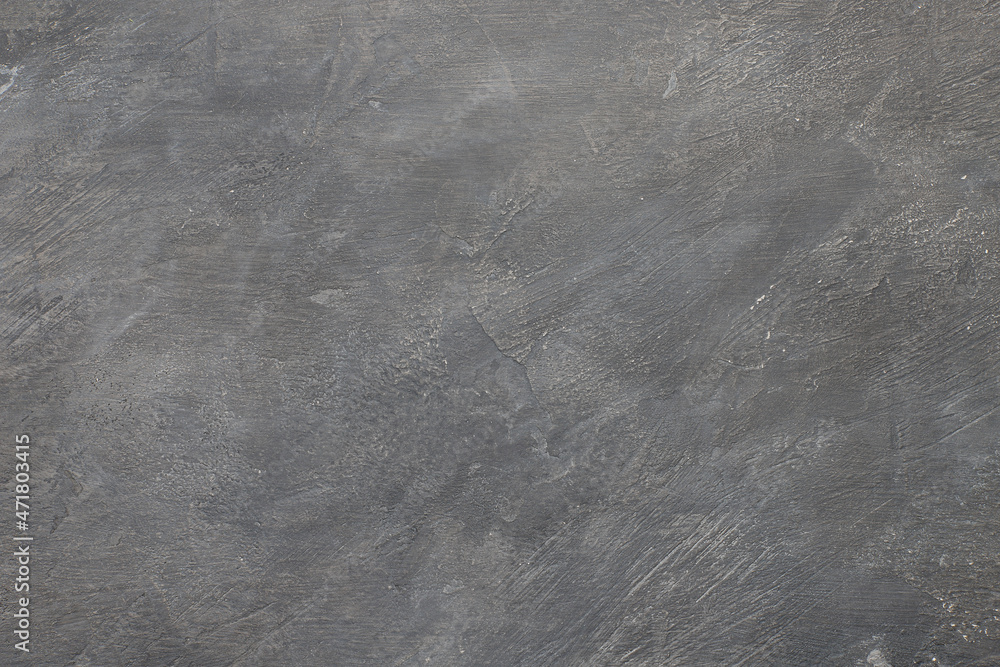 Fototapeta premium Empty dark gray concrete background with scratches and bumps. Concrete texture close-up