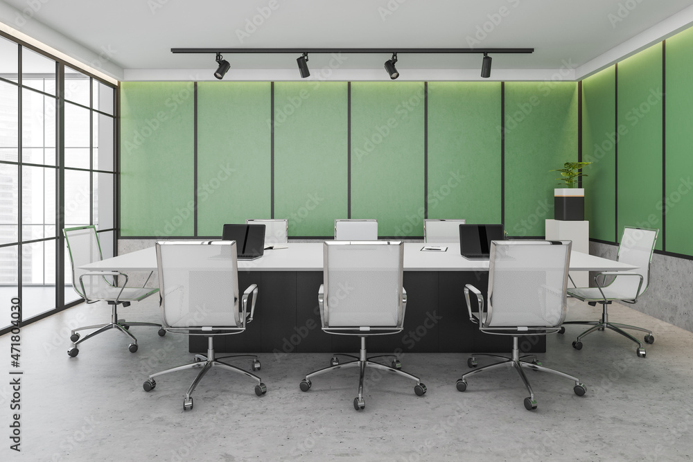 Green conference room interior with furniture and windows