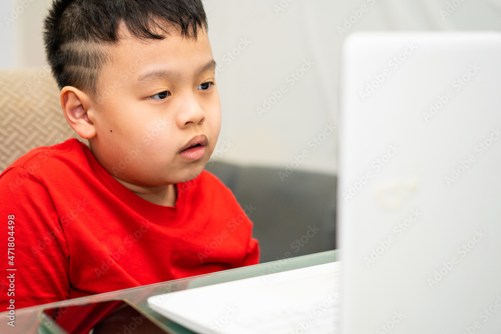 kid do education by online learning with laptop or tablet computer at home in quarantine called e-learning communication to teacher or tutor kid do education by online learning with laptop or tablet computer at home in quarantine called e-learning communication to teacher or tutor