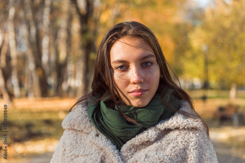 teen girl autumn portrait outdoor, look at camera teen girl autumn portrait outdoor, look at camera