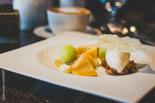 Granny Smith Caramelised apple “lagasna”, black honey ice cream, hazelnuts photo