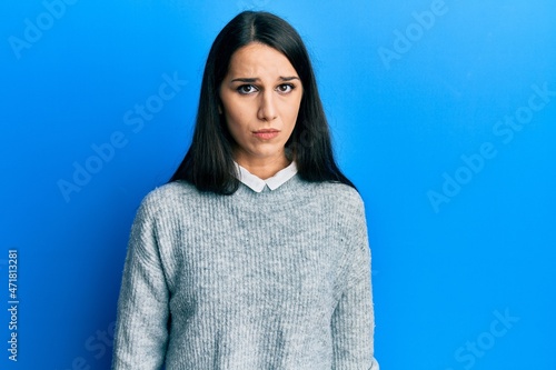 Young hispanic woman wearing casual clothes depressed and worry for distress, crying angry and afraid. sad expression.