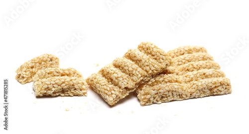 Sesame bar pieces isolated on white background