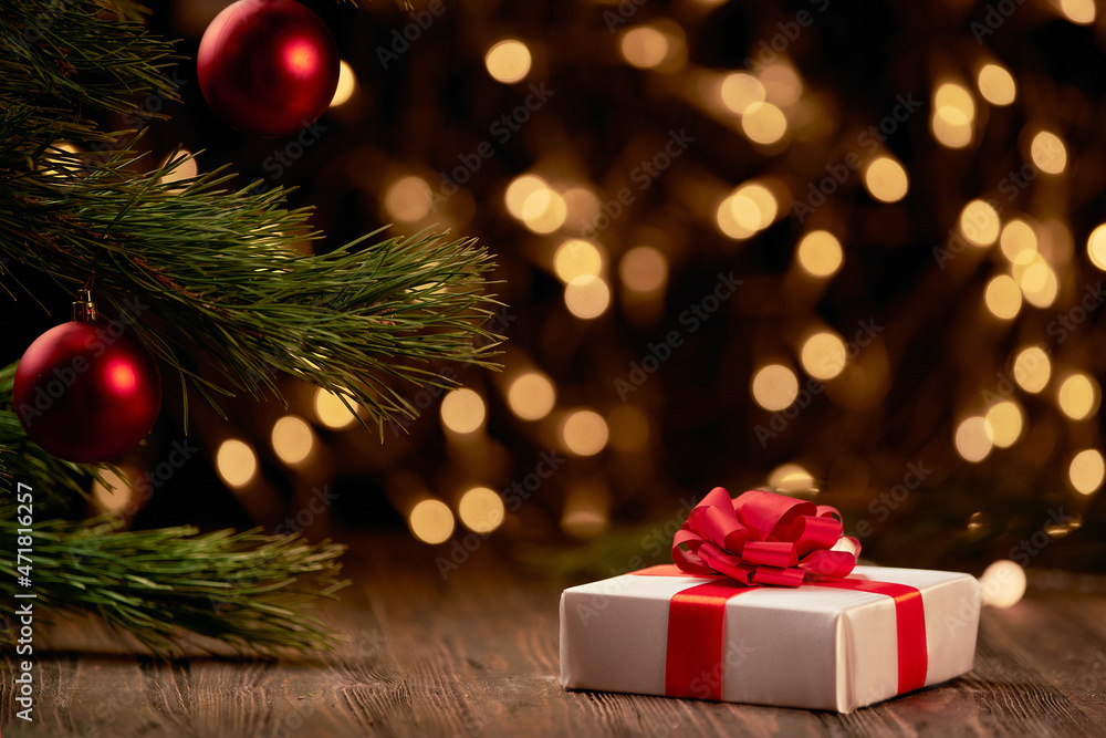 package with gifts on a festive Christmas background.