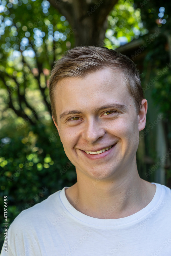 handsome young man in the garden with positive smiling face handsome young man in the garden with positive smiling face