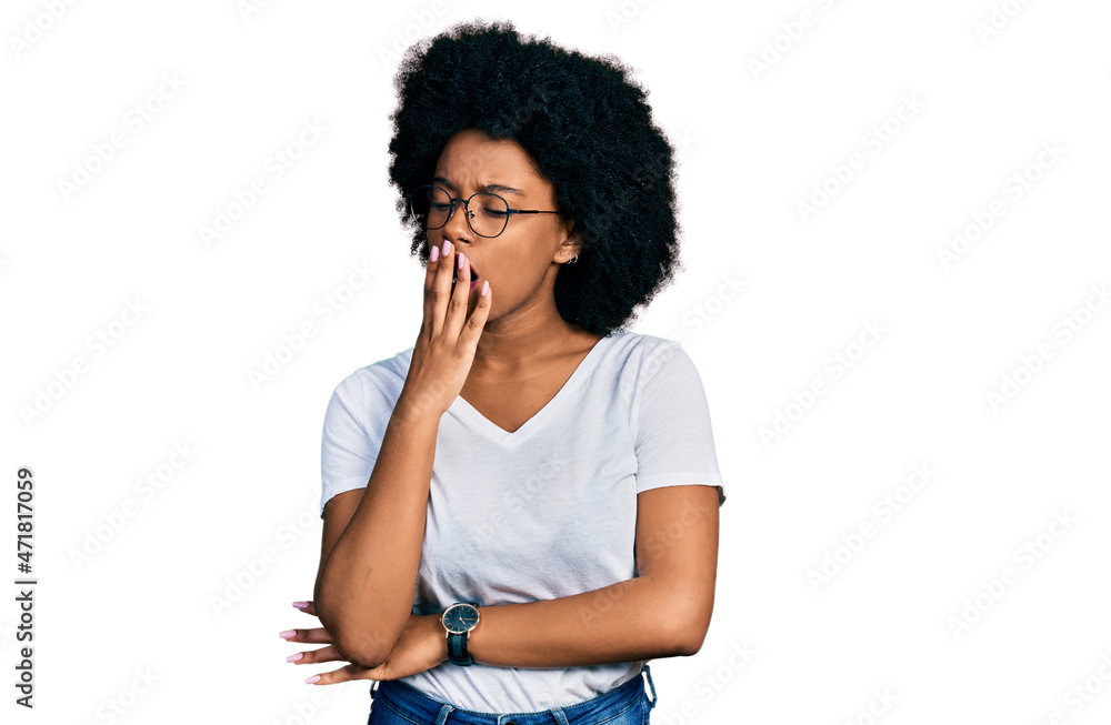 Young african american woman wearing casual white t shirt bored yawning tired covering mouth with hand. restless and sleepiness. Young african american woman wearing casual white t shirt bored yawning tired covering mouth with hand. restless and sleepiness.