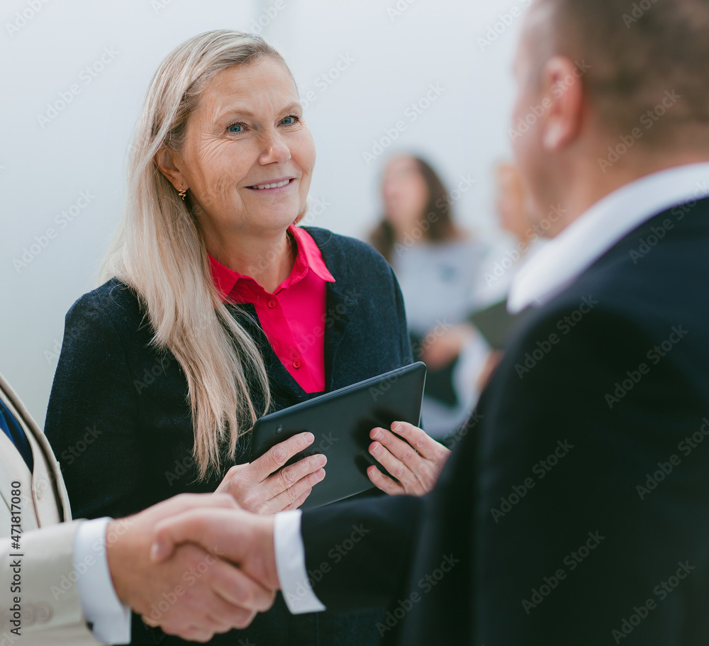 close up. business people meet each other with a handshake. close up. business people meet each other with a handshake.
