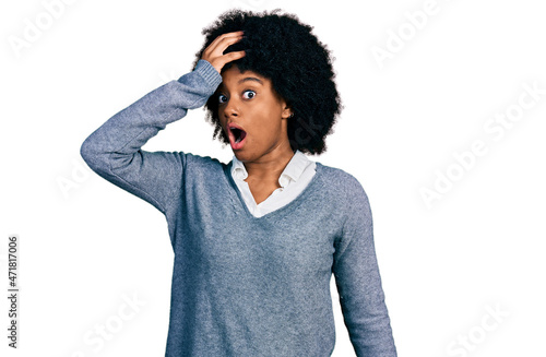 Young african american woman wearing business clothes surprised with hand on head for mistake, remember error. forgot, bad memory concept.