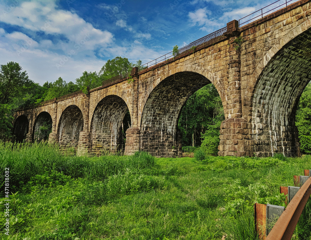 Historical old arched bridge of the Thomas Viaduct in Elrkridge Maryland.