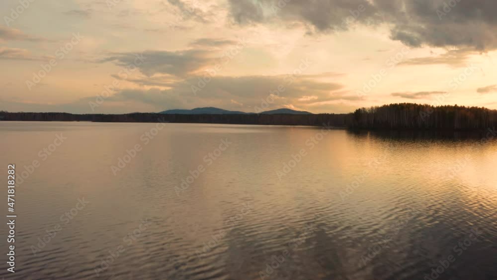 Aerial view of the natural landscape forest on the lake shore at sunset Aerial view of the natural landscape forest on the lake shore at sunset