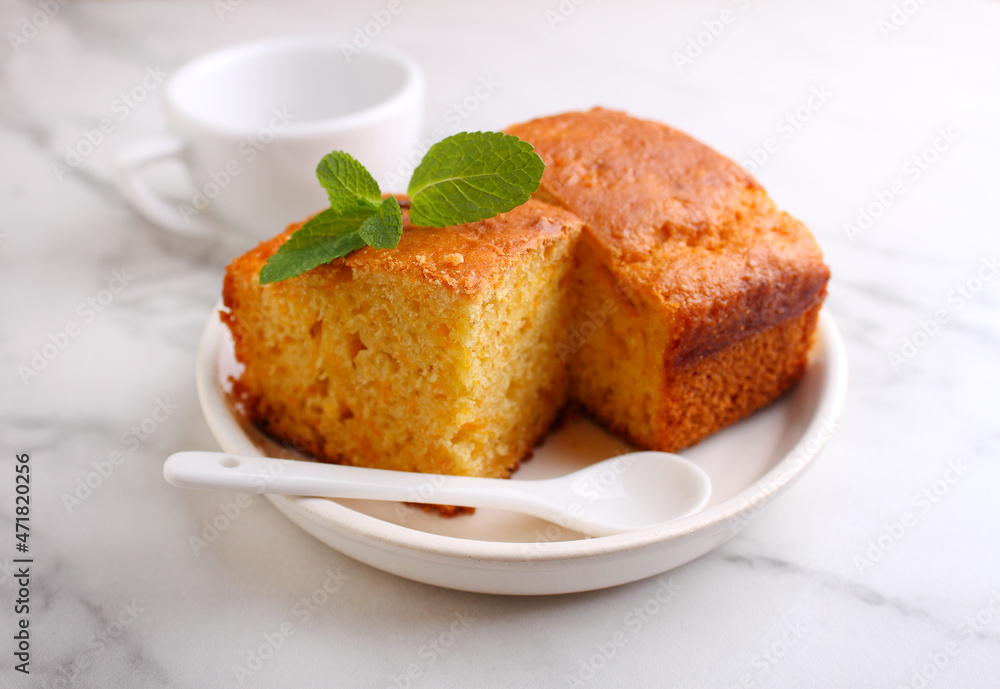 Semolina cake with pumpkin cut into pieces and garnished with mint Semolina cake with pumpkin cut into pieces and garnished with mint