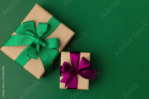 Gift boxes wrapped in craft paper with ribbon and bow