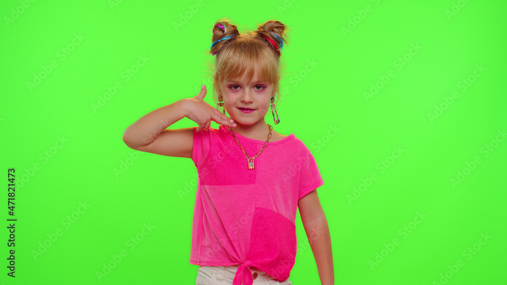 Joyful little Caucasian kid girl blogger front of phone camera record video enjoy dance content on green chroma key background. Social distance coronavirus pandemic concept. Freedom active lifestyle Joyful little Caucasian kid girl blogger front of phone camera record video enjoy dance content on green chroma key background. Social distance coronavirus pandemic concept. Freedom active lifestyle