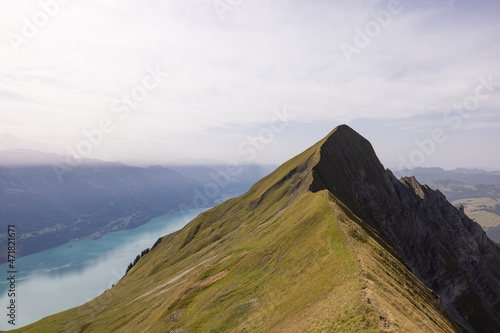 Amazing hiking day in the alps of Switzerland. Wonderful view over a beautiful lake called Brienzersee. What an amazing view. photo