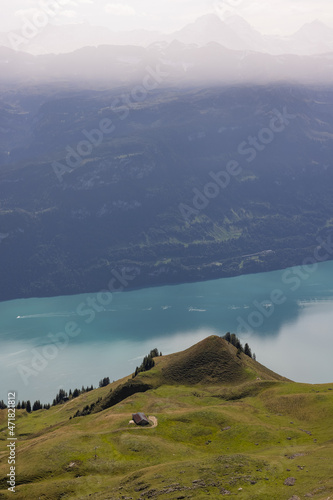 Amazing hiking day in the alps of Switzerland. Wonderful view over a beautiful lake called Brienzersee. What an amazing view. photo