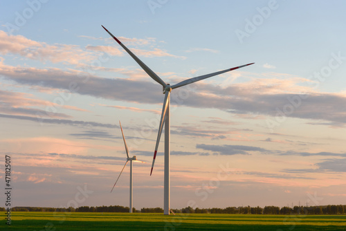 View on alternative energy windmills in a windpark in Ulyanovsk at sunset. Windmills for electric power production.