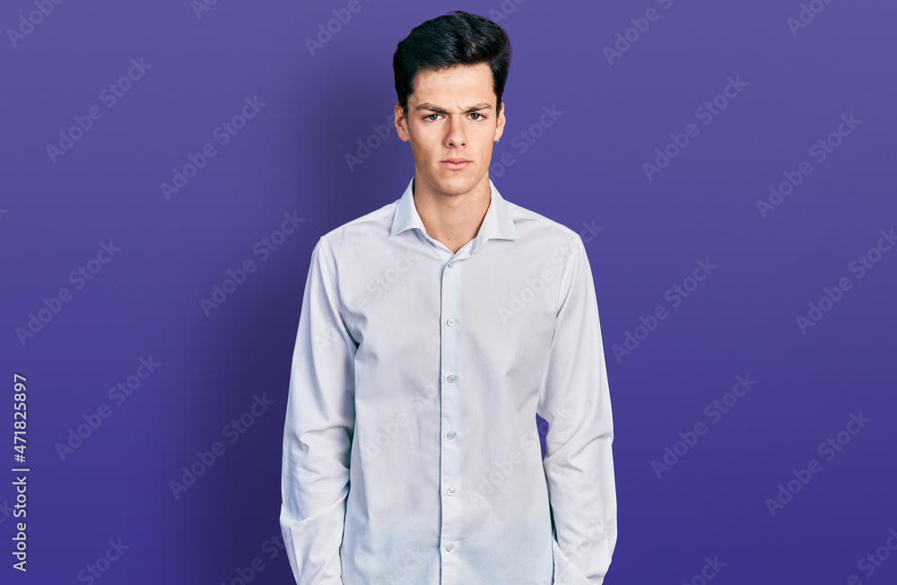 Obraz premium Young hispanic business man wearing business clothes skeptic and nervous, frowning upset because of problem. negative person.