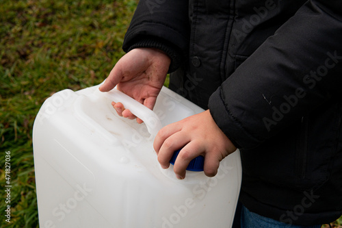 the guy who unscrews the lid on the canister photo