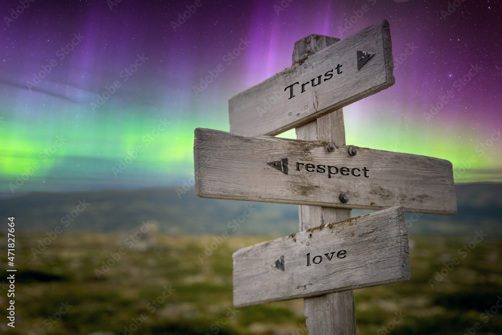 trust respect love text quote on wooden signpost outdoors in nature with northern lights above. - obrazy, fototapety, plakaty 