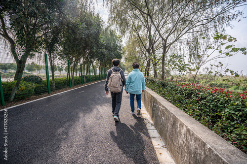 couple walking in the park © Sakon