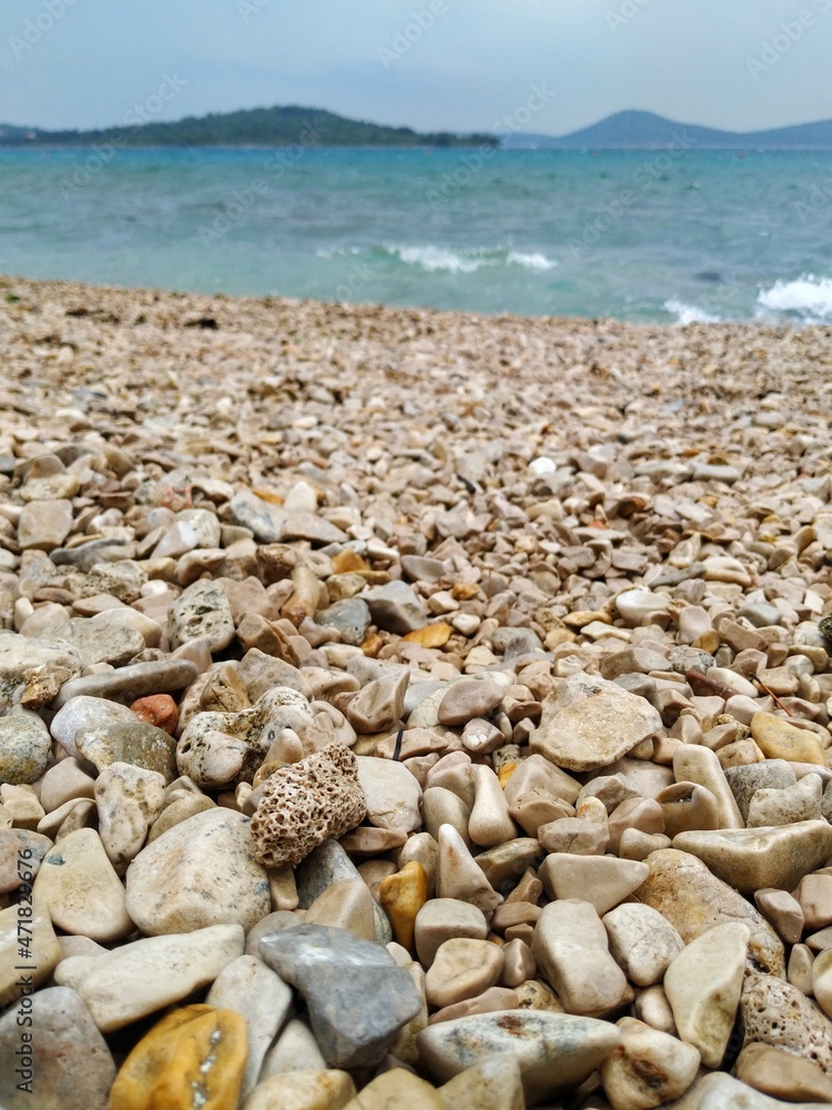 Pebbles of different sizes and shapes on the beach of the Adriatic sea Pebbles of different sizes and shapes on the beach of the Adriatic sea