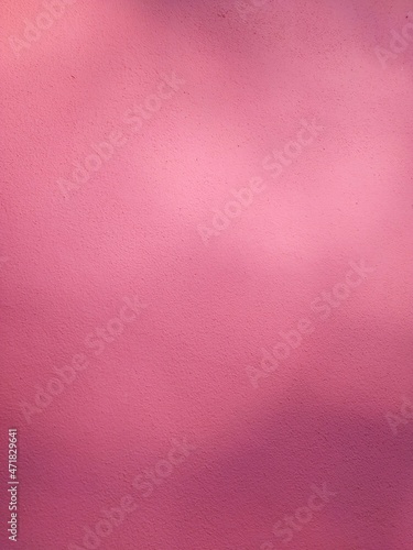 Gradient pink wall of the building in the sunlight