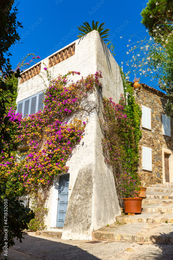 View of narrow charming streets in small French township of Grimaud in sunny summer day, Var department.