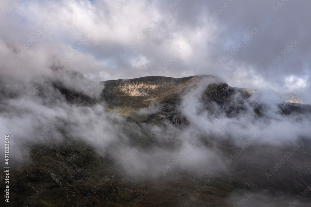 Aerial view of flying drone Dramatic epic landscape image in Autumn of Y-Garn in Snowdonia National Park