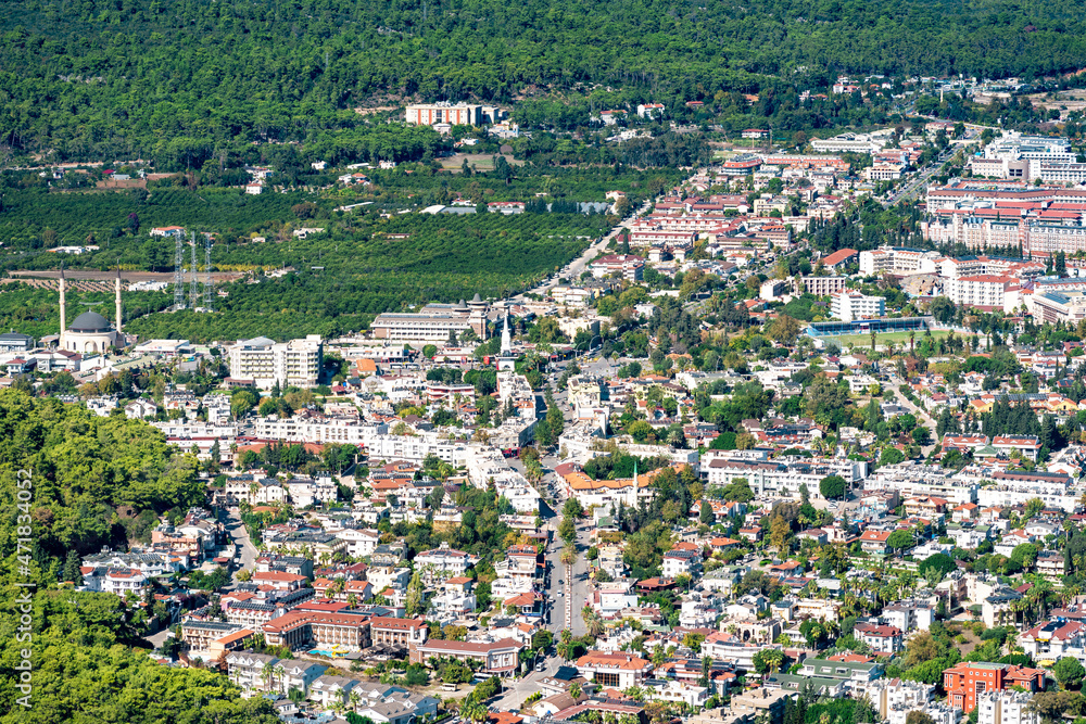 top view of urban quarters and suburban fields in beautiful valley in Kemer, Turkey