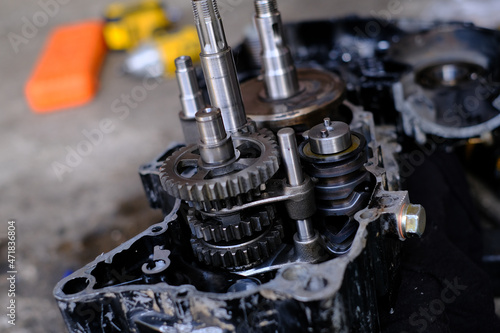 Assemble the motorcycle engine gear by a maintenance technician and check it.