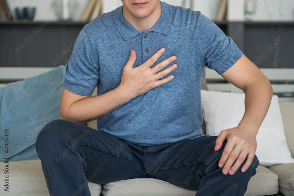Chest pain and cough, man with lung ache at home Stock Photo Adobe Stock