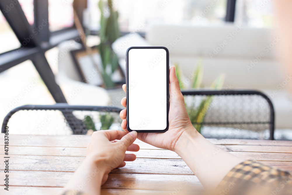 cell phone blank white screen mockup.hand holding texting using mobile on desk at office.background empty space for advertise.work people contact marketing business,technology cell phone blank white screen mockup.hand holding texting using mobile on desk at office.background empty space for advertise.work people contact marketing business,technology