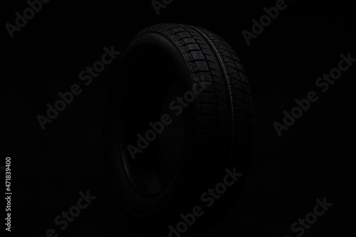 black tire on a black background