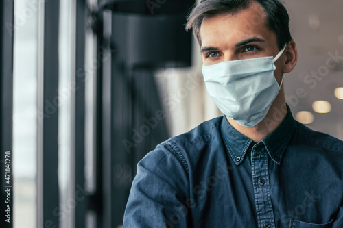 business colleagues in protective masks working with financial documents.