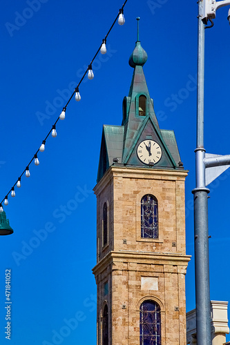 Tel-aviv, Israel - November 11, 2021: Jaffa Clock Tower. built in 1906 from limestone blocks to celebrate the 25th anniversary of Ottoman Sultan Abdul Hamid II.