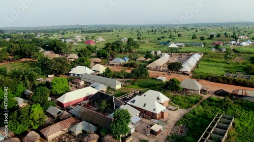 Rukubi community in rural Nigeria, West Africa with a scenic view of houses and farmland - aerial ascending view photo