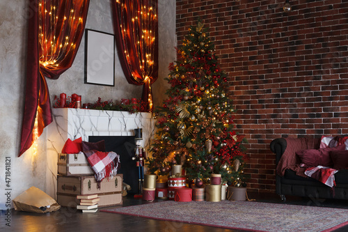 Christmas, New Year interior with red brick vintage wall background, decorated fir tree with garlands and curtain, sofa with plaid and fireplace © oksioma