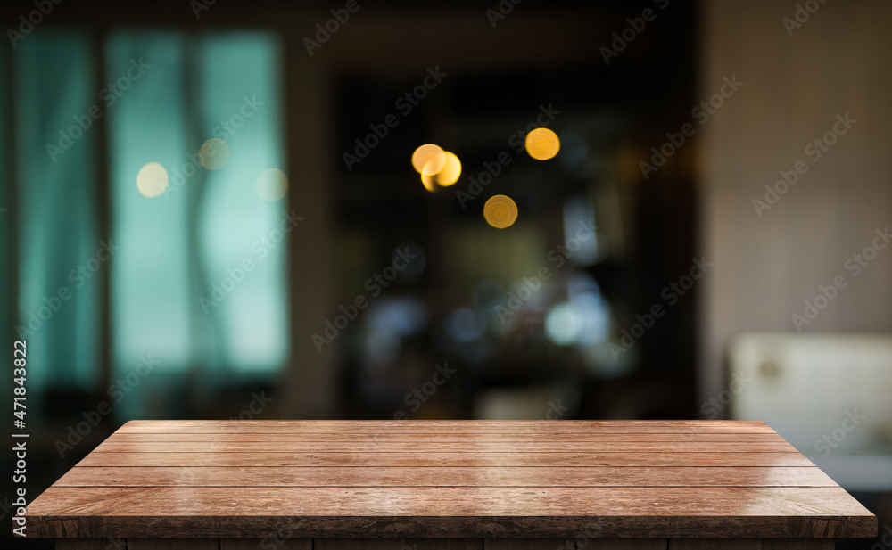 Empty wooden table top with lights bokeh on blur restaurant background Empty wooden table top with lights bokeh on blur restaurant background