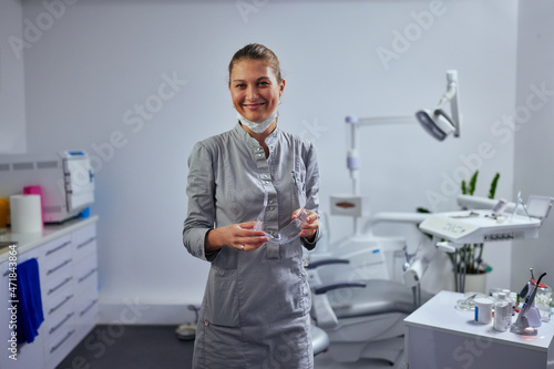 Beautiful dentist in her office