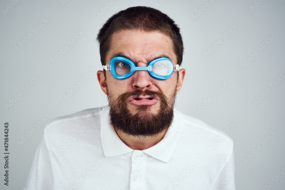 man wearing goggles for swimming emotions fun close-up man wearing goggles for swimming emotions fun close-up