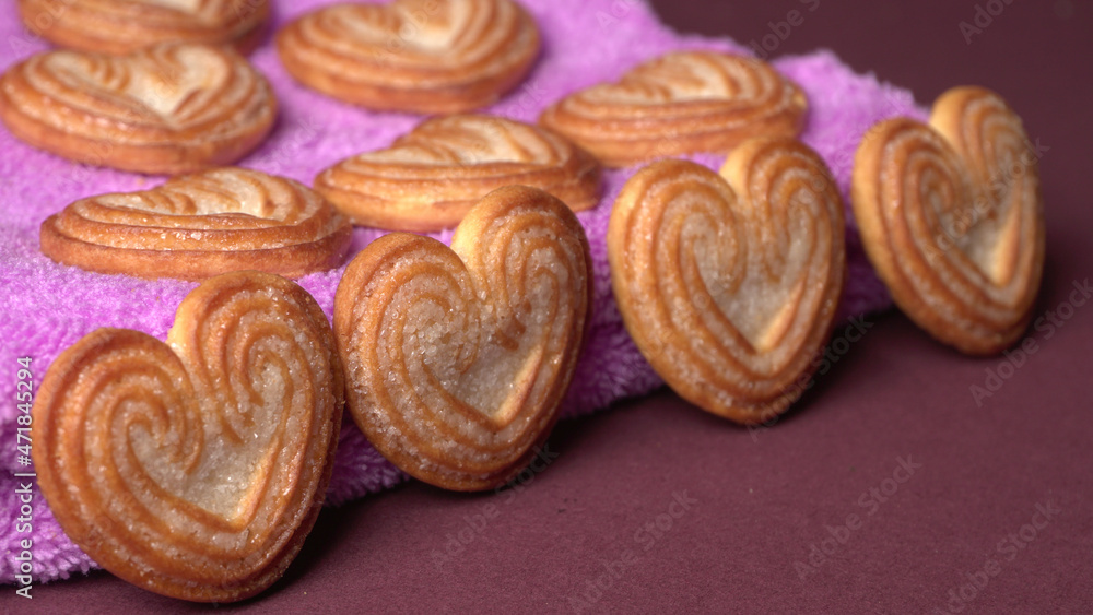 Fototapeta premium Delicious homemade heart shaped cookie on a color background. Top View. Place for text. 