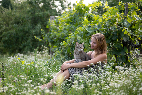 Photography Happy woman with cats and wild flowers