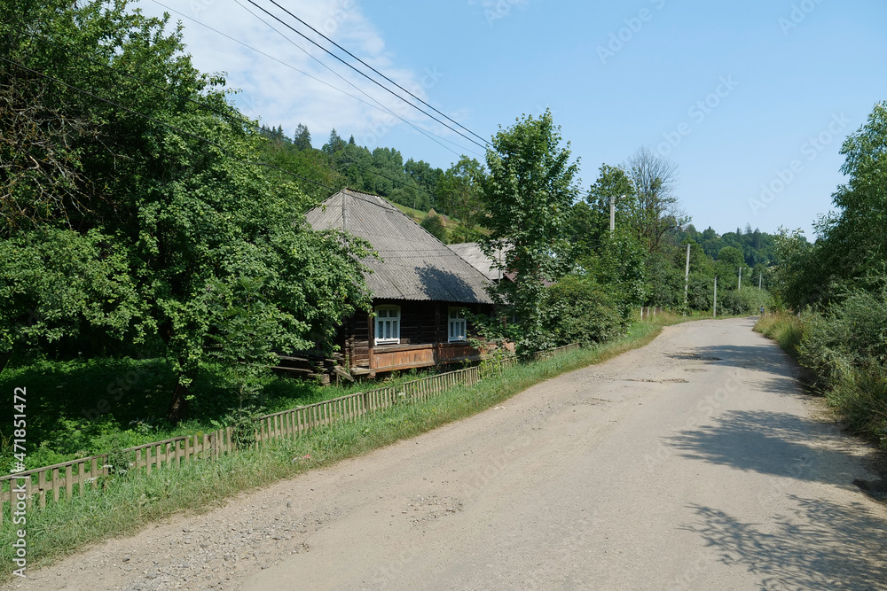 Old wooden house in village in Carpathian Mountains, Ukraine