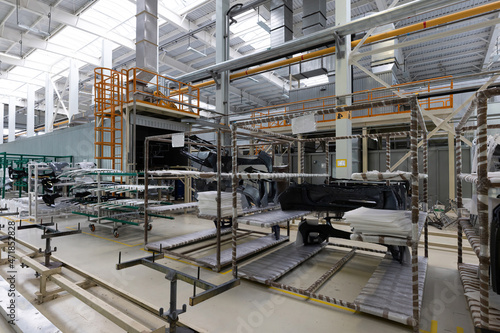 Photo of a warehouse with shelves with spare parts for cars and automobiles